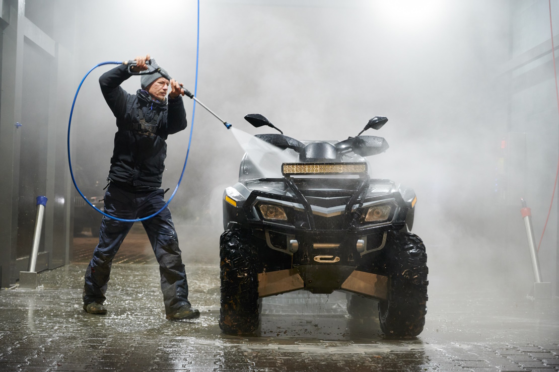 ATV being cleaned after a muddy ride